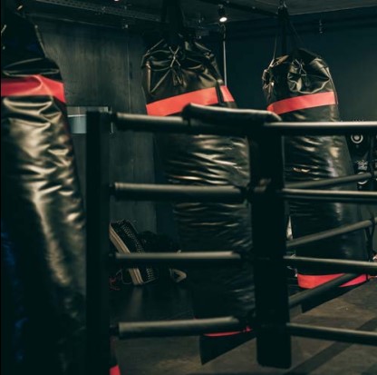 fighting-ring-with-punching-bags